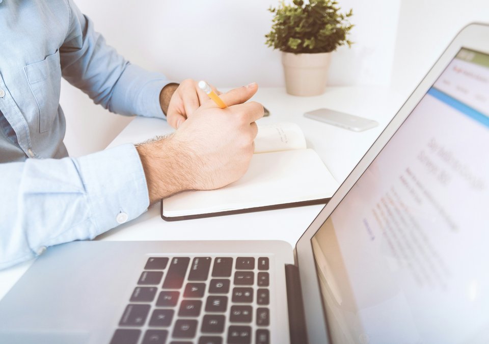 man requesting their property deeds using a laptop in the uk